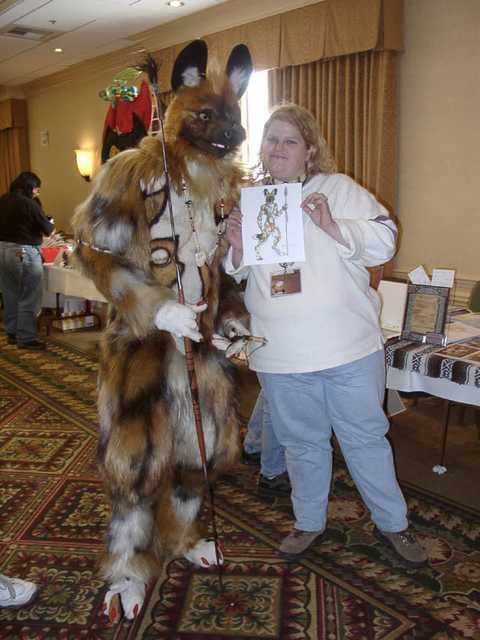 Lutalo - Extremely well-done African wild dog, posing with a drawing of himself. (FC2002)
