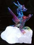 Rainbow - Colored-glass dragon on quartz base.