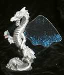 Sea Wyrm - Fairy-winged wyrm rises up from the waves, bearing a jewel.