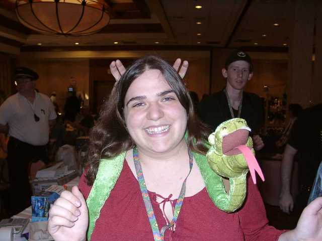 Eapa, everyone's favorite boobie-snake, with a prankster behind her. (FC2003)